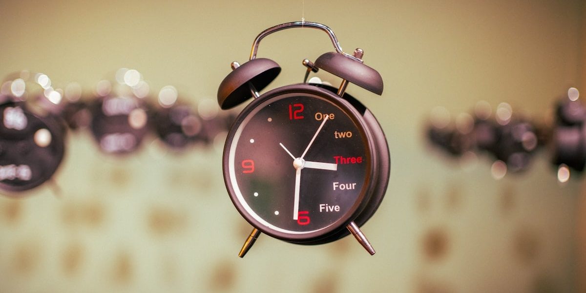 an alarm clock hanging from the ceiling in a room