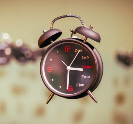 an alarm clock hanging from the ceiling in a room
